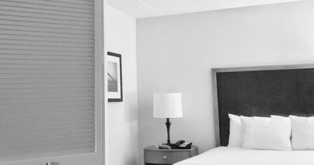 White hotel bed linens ready for short-term rental turnover