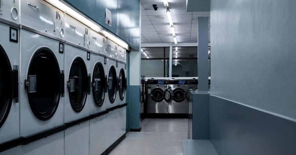 Row of commercial front load washing machines